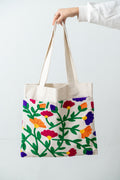 Floral Tote – natural DAKK tote with a colourful floral pocket, by Noha Fathy